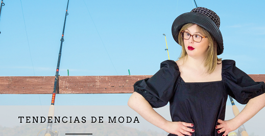 Paola posando con sombrero y vestido negro